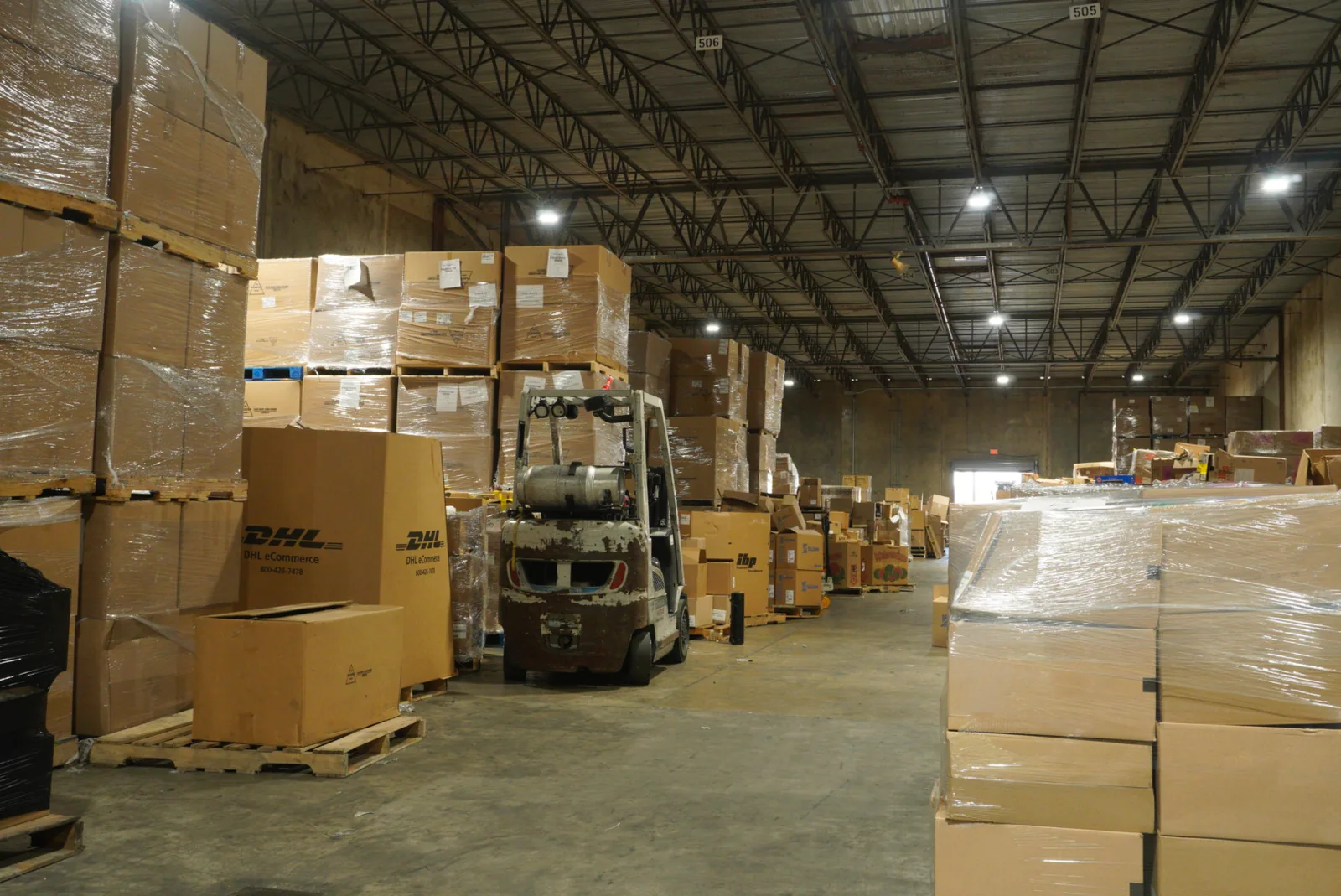 Pallets stacked by the truckload inside the Elegant Wholesale Outlet warehouse